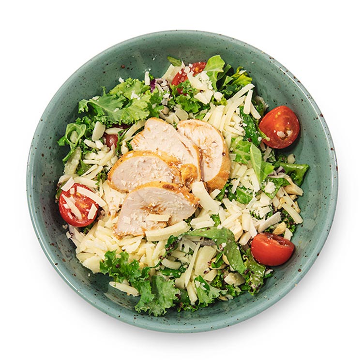 Maträtten Kale Caesar Sallad i en skål